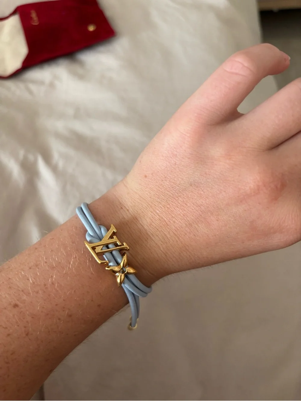 Louis Vuitton Light Blue Leather Cord Bracelet with Gold LV Charm